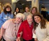 Associates and residents come together for a heartwarming group photo during the day of service activities.