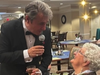Frank Sinatra impersonator serenades a resident during the “Swingin’ Affair” tribute performance.