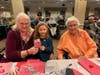 River Edge Girl Scouts join Juniper Village residents to write Valentine's cards for veterans and active-duty troops, creating meaningful intergenerational connections while honoring those who have served.