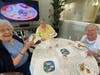 Residents celebrate National Peanut Butter Cookie Day with giraffe-shaped cookies honoring their mascot! 
