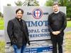 The Reverends Mario Melendez and Charles Cowherd in front of St. Timothy's new sign on Van Buren St. 