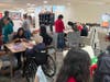 Juniper residents and Delcastle Technical High School students work side by side during the Second Annual Bridging Generations: A Day of Service, assembling care packages and service projects while building meaningful connections across generations. 