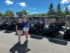 Lindsay Tasher (left), CHN Golf Classic & Pickleball Tournament Co-Chair, and Beth Blakey (right), CHN Executive Director and COO, in front of the golf carts as they are getting ready for the shotgun start. 