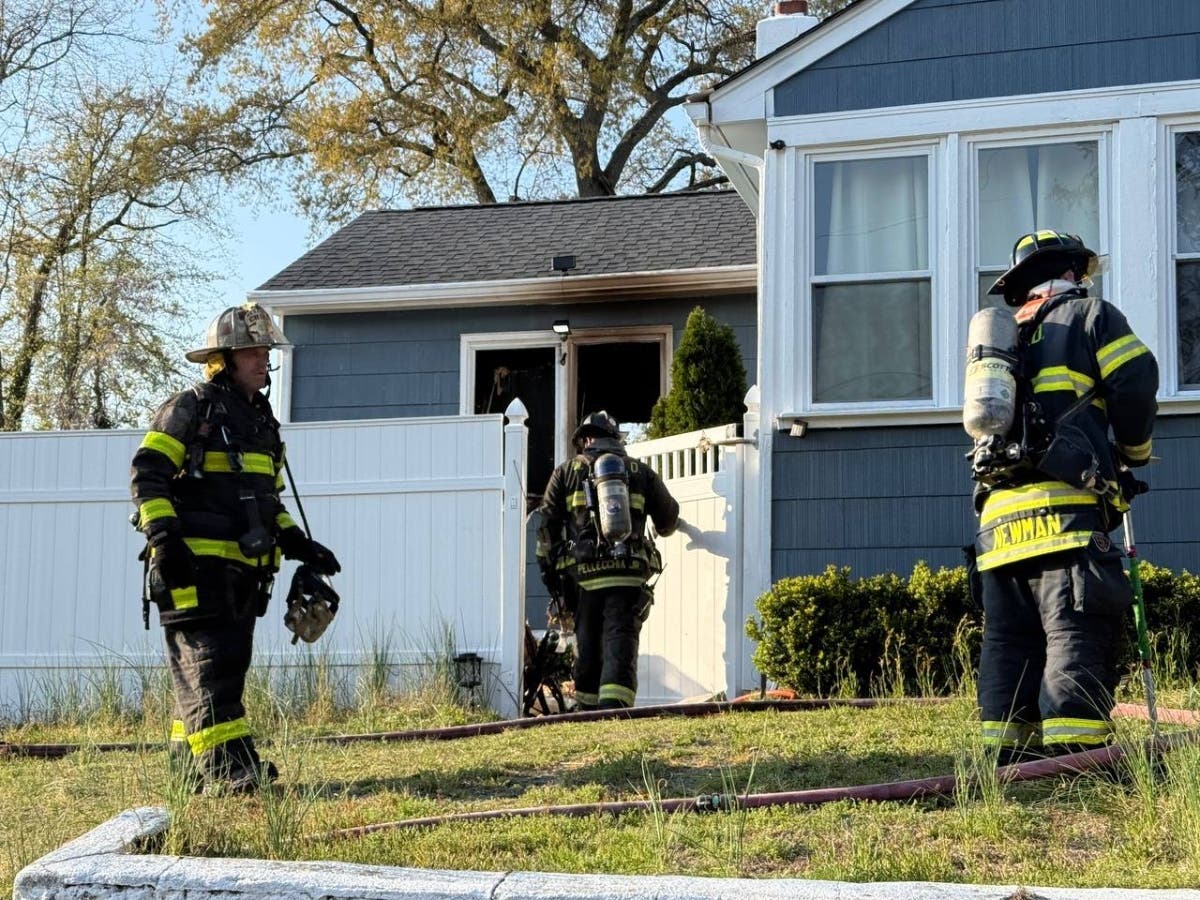 Firefighters responding to the fire on Curtis Avenue.