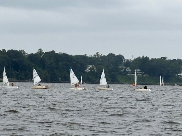The sun sets over the Navesink as River Rats celebrate a successful season of sailing.