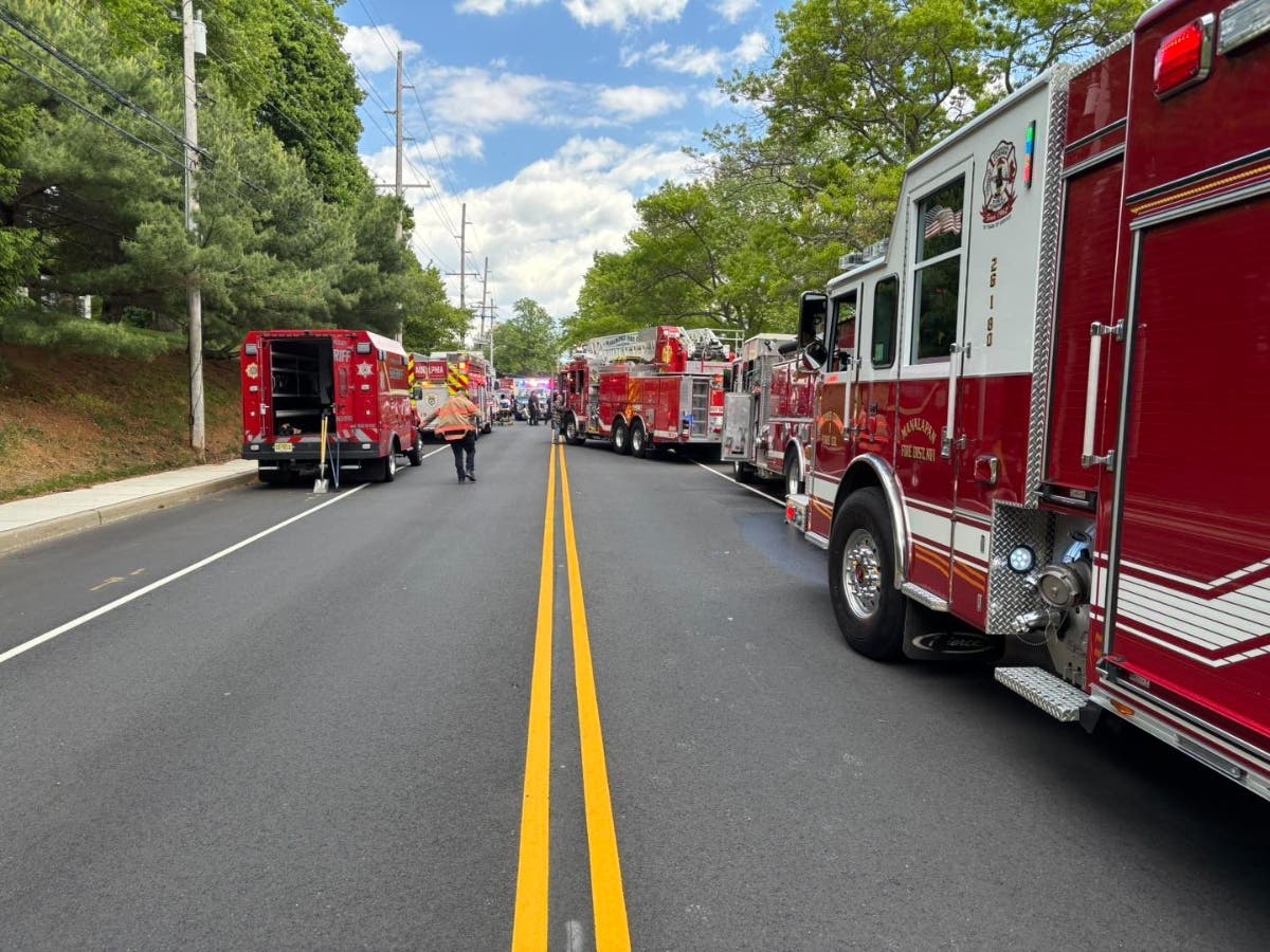 Emergency services responding to the fire in East Freehold Township.