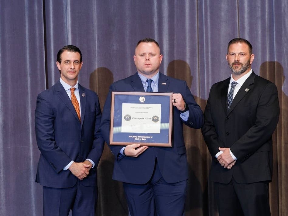 Sgt. Chris Mason with a certificate from the NJ State Association of Chiefs of Police Command & Leadership Academy.