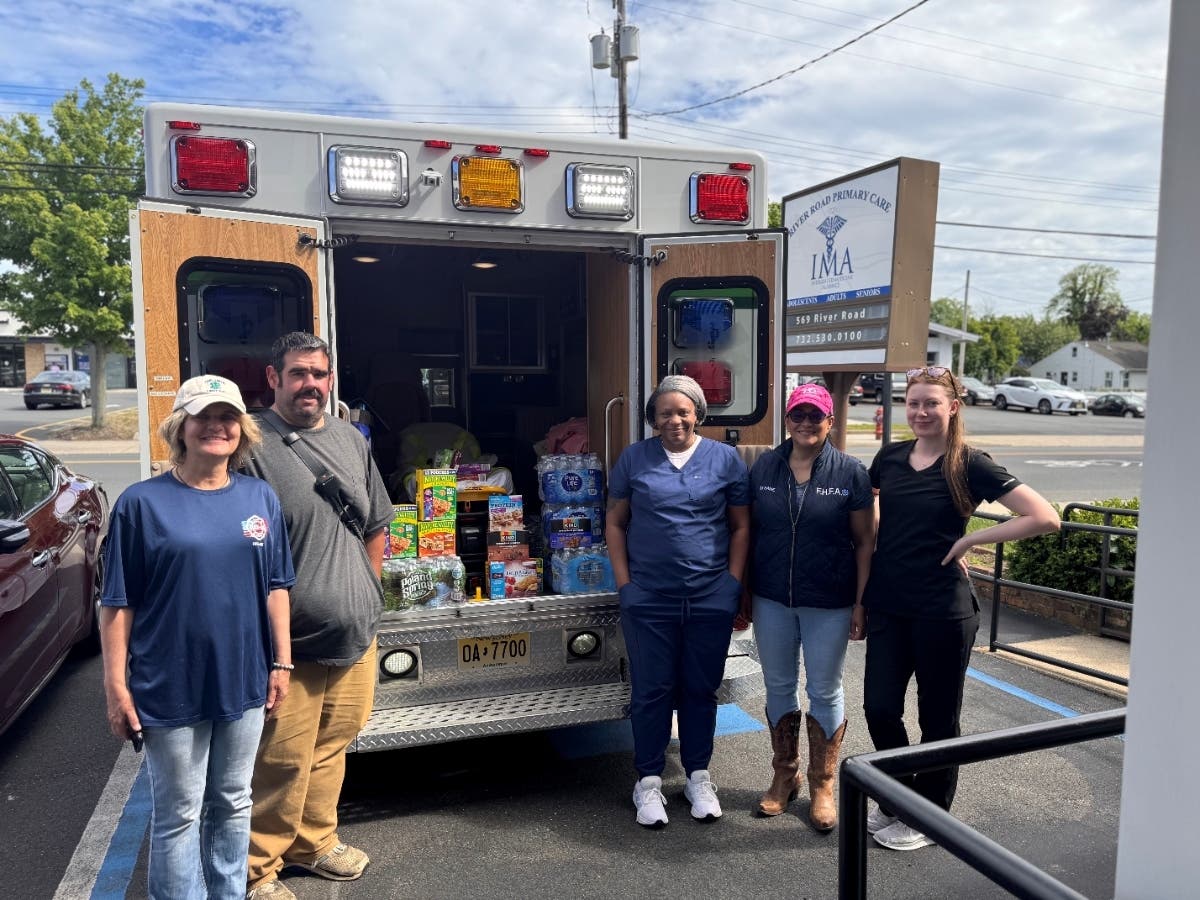 Members of Fair Haven First Aid Squad and River Road Primary Care with donations.