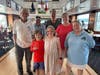 River Rats members pose with youth sailors, Winston Fils and Isabella Schiavetti. In the back row, L-R, are Frank Munn, Joe Malik, Jeff Siegal, and Christine Schiavetti. In the front row are, L-R, Winston Fils, Isabella Schiavetti, and Jill Lynch.