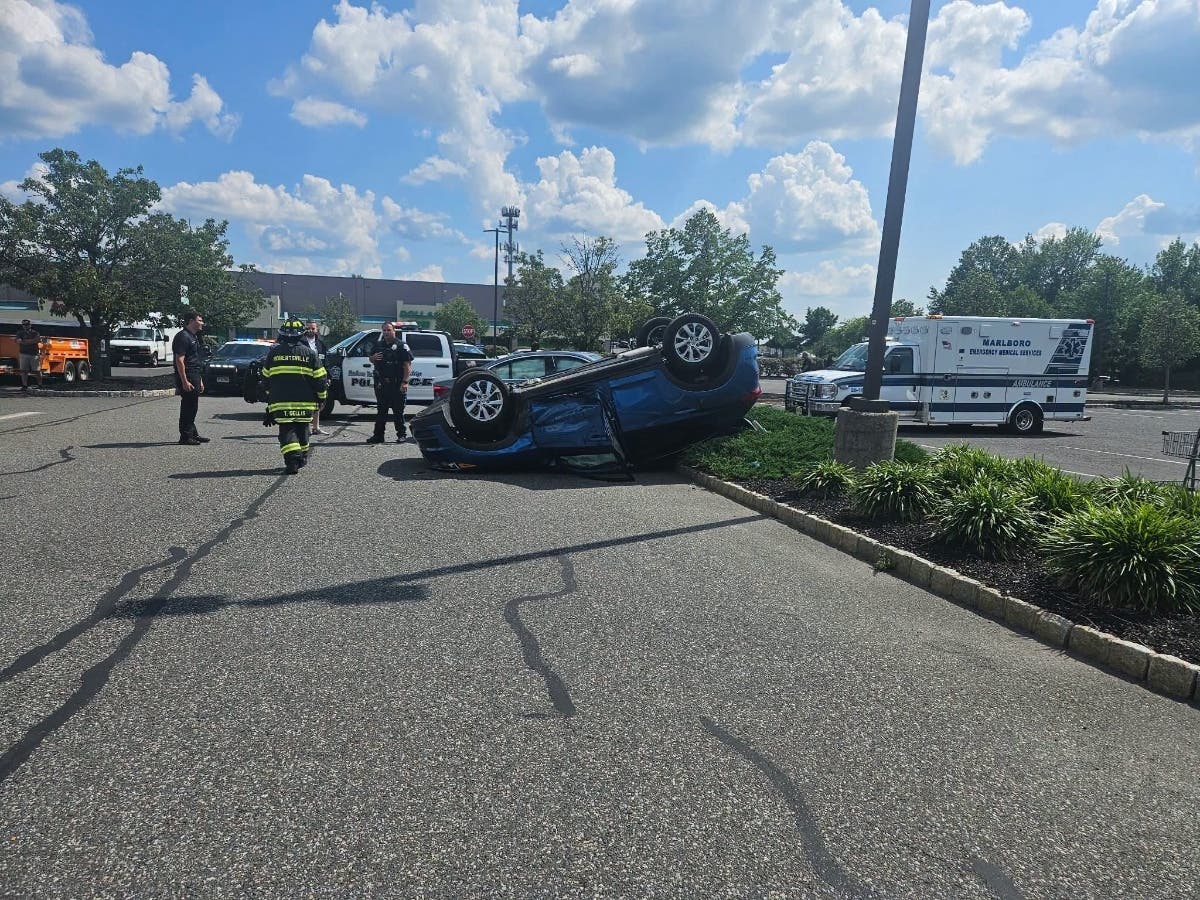 Authorities respond to the overturned vehicle.