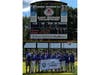 The Freehold Township Little League team with their East Junior League Baseball Champions banner.