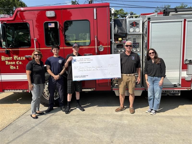 NJ American Water presents a $2,500 Volunteer Fire & EMS Grant to River Plaza Hose Company No. 1. (L-R): Dawn Turner; Firefighter Richard Holton; 3rd Lieutenant Bryan Dolan; Joe Sole; and Ashley Bromiley.