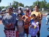 A family receiving backpacks.