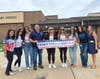 Dugan PTO members honoring first responders.