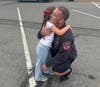 A student with a local first responder at the parade.