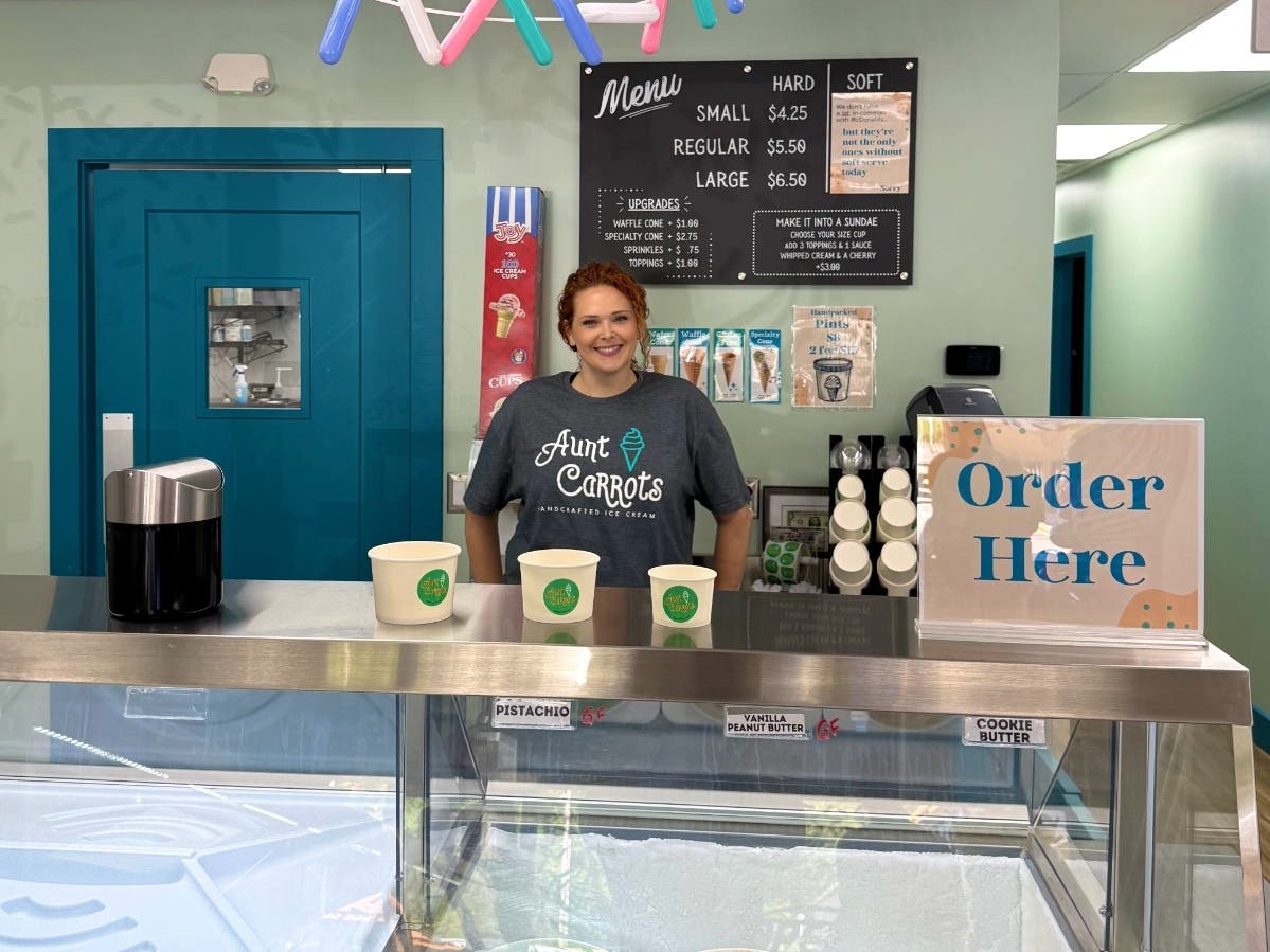 Kara Gaul behind the counter at Aunt Carrots.