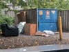 A dumpster at Leesburg Apartments on Saturday, Sept. 28, 2024. Town code prohibits trash or bulk items being placed outside dumpster areas.