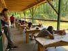 Scouts using firearms at a range.