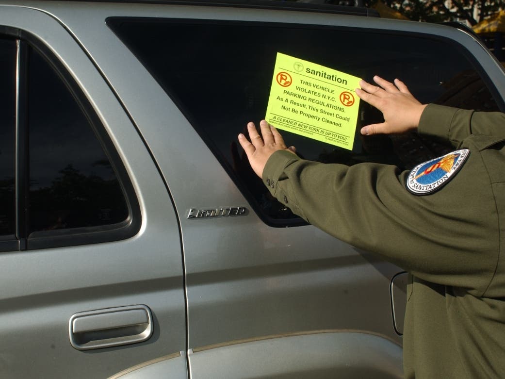 Drivers who violate street-cleaning rules will still receive a parking ticket — in addition to the large sticker — to make the violation more visible and encourage future compliance.