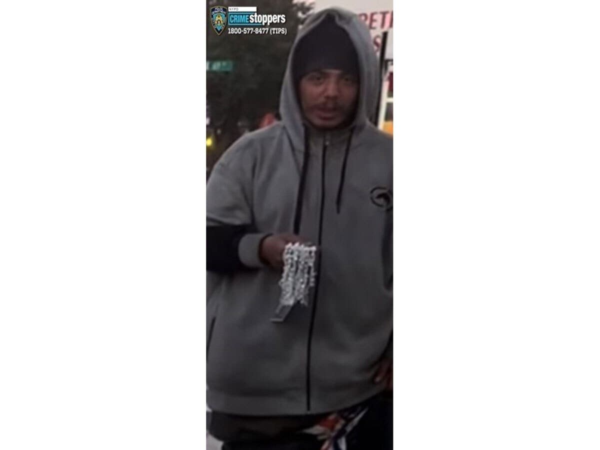 The missing man is described as a man with black hair and brown eyes wearing a black and grey sweatshirt, army green pants, and black and white sneakers.