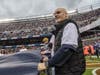 Gary Brown, an Advocate Health Care patient, helped unfurl the Bear Down flag at Soldier Field during the Chicago Bears game on Sunday, November 10, 2024.