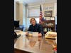 Mayor Pam with her postcard from Glen Cove