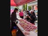 A Candied fruit vendor was popular with all ages.