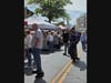 Crowds shopping on a sunny day.