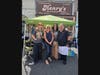 Wood and Lotus Studio artists, Lorraine Baker and Laurie Giannola, along with Glen Cove Mayor Pam Panzenbeck and Henry's owner, Joe Valensisi.