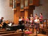Mr. Crowley brings his creativity to the CJB student choir as they sing at weekly Mass 
