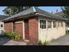 Chamberlain House Garage on Pleasant Street in need of roof, window and door repair which will be funded in part by a 1772 Foundation grant.