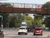 Two Glenview residents and three Morton Grove residents displayed large banners and waved small American flags from Cook County Forest Preserve Bridge on Friday. 