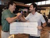Organizers Drew Hauber, left, and Alex Przybylo celebrate raising $26,665 for The Children’s Heart Foundation during the after dinner and award ceremony.