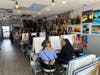 Brushes up, worries down. A room full of creativity, laughter, and Prince in the air #SipAndPaintVibes