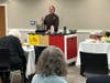 Metro Bis, Chris Prosperi prepares a meal for Simsbury Public Library donors. 