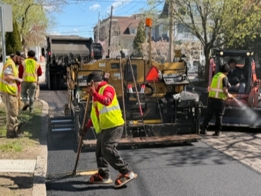 Crews conduct paving operations on Park Street.