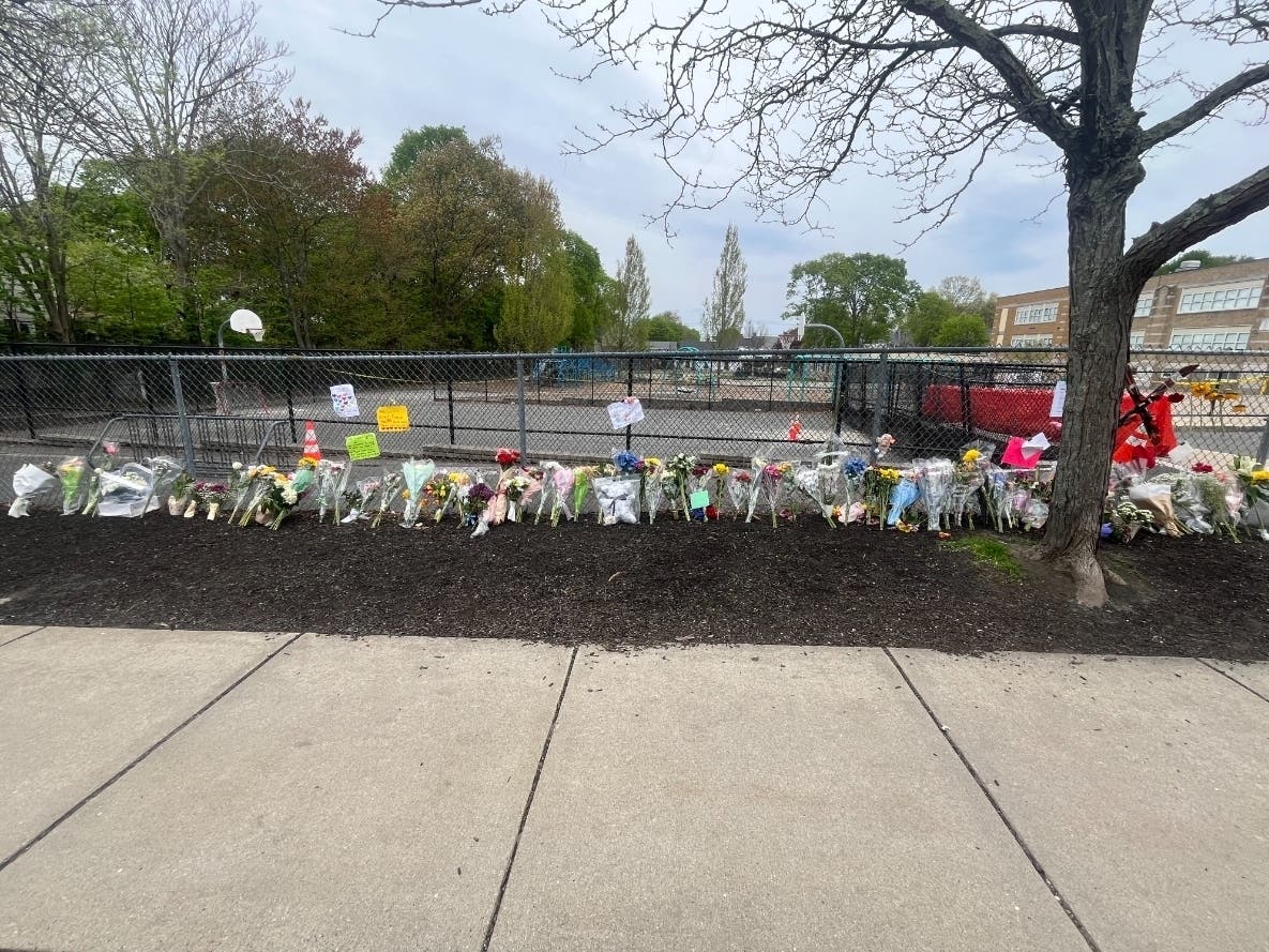 Dozens of demonstrations of support, sympathy, and remembrance are on display outside the school on First Street.
