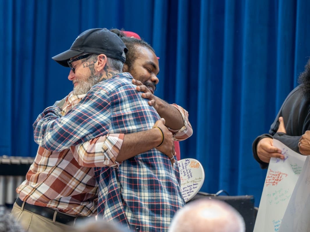 Allen embraced with the person he helped save the life of.