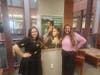 From left, Emily Hampton and Erin Cool, proudly display a photo collection
from this year's Black History Month at Carroll Community College.