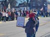 An unidentified protester displays her views via her special signage.