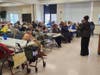 Dr. Frances (Toni) Murphy Draper addresses audience members at Heritage Augsburg senior living facilities in Gwynn Oak, Baltimore County.