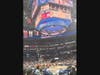 A courtside view, displays thousands of spectators viewing the game
from upper-level rafters at Capital One Arena.