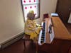 A veteran church pianist, well-known in the Baltimore church community - displayed her God-given talents at Pastor Johnson's anniversary affair. Her identity was unknown at press time.
