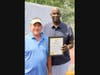 Canton Mayor William Sherer II, provides a city proclamation to Phil Hubbard, officially commemorating the renaming of the basketball court in Hubbard's honor. Both men are graduates of the legendary Canton-McKinley High School.
