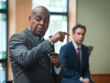 Newark Mayor Ras Baraka addresses the assembly as Jersey City Mayor Steven Fulop looks on, highlighting the urgent need for affordable, inclusive housing across New Jersey.
