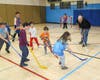 Kids from the Y’s youth sports programs playing ball hockey with members of the Flyers Warriors team of US military veterans