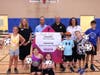 (L-R) Allyson Fox, VP of operations for the Quakertown branch; Anthony Caruso, president/CEO of KwikGoal, Ltd.; Zane Moore, president/CEO of River Crossing YMCA; Debbie Sontupe, chief development officer of the Y with campers celebrate Caruso's commitment