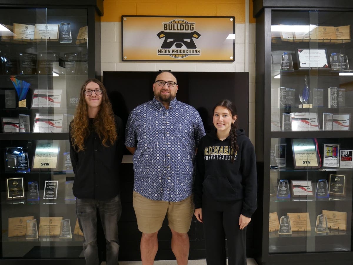 (Left to right) Harold L. Richards High School junior Grady Gilhooly, teacher Aaron Vermedal, and senior Grace Tresch are nominated for Outstanding Magazine Program in the 2026 National Student Production Awards.