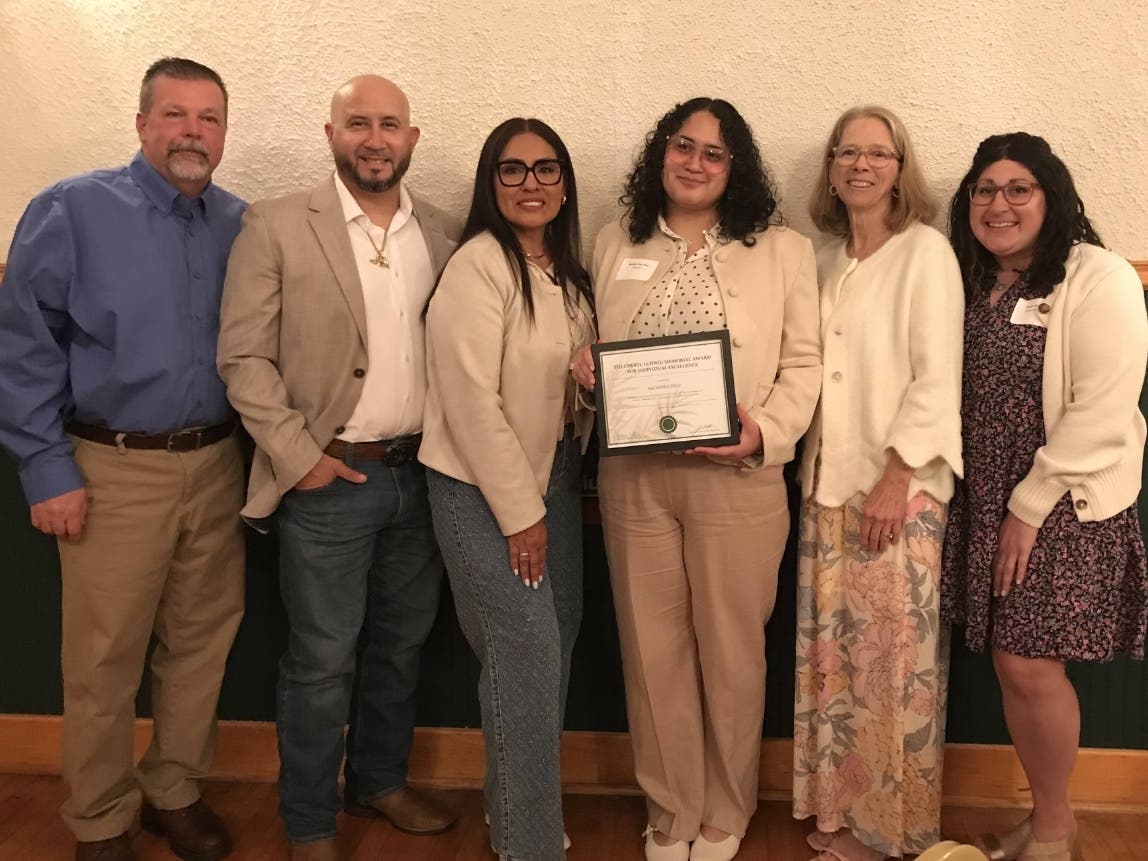 One of Juniper's Work Immersion Interns, Alondra Diaz, accepting the prestigious Cheryl Ludwig Memorial Award in recognition of her exceptional personal growth and achievements in the areas of job skills. 