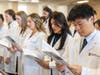 First-year dental student David Nguyen recites The Dentist’s Pledge along with other first-year dental students.